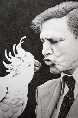Portrait of David Attenborough kissing a cockatoo